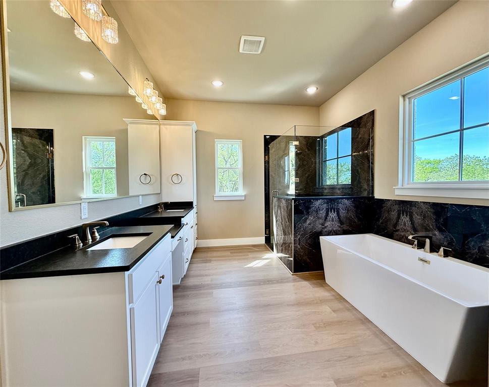 114 Ridgeline Drive Chico, TX 76431 - Photo 12 of 23 a large spacious bathroom with a large tub and sink