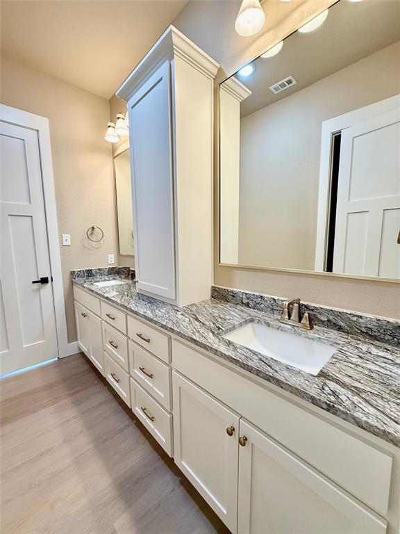 114 Ridgeline Drive Chico, TX 76431 - Photo 13 of 23 a spacious bathroom with double sink and a mirror