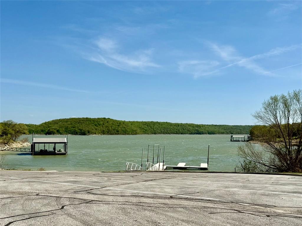 114 Ridgeline Drive Chico, TX 76431 - Photo 21 of 23 a view of a lake with houses in the background