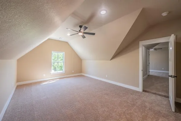 a view of a lake with houses in the background