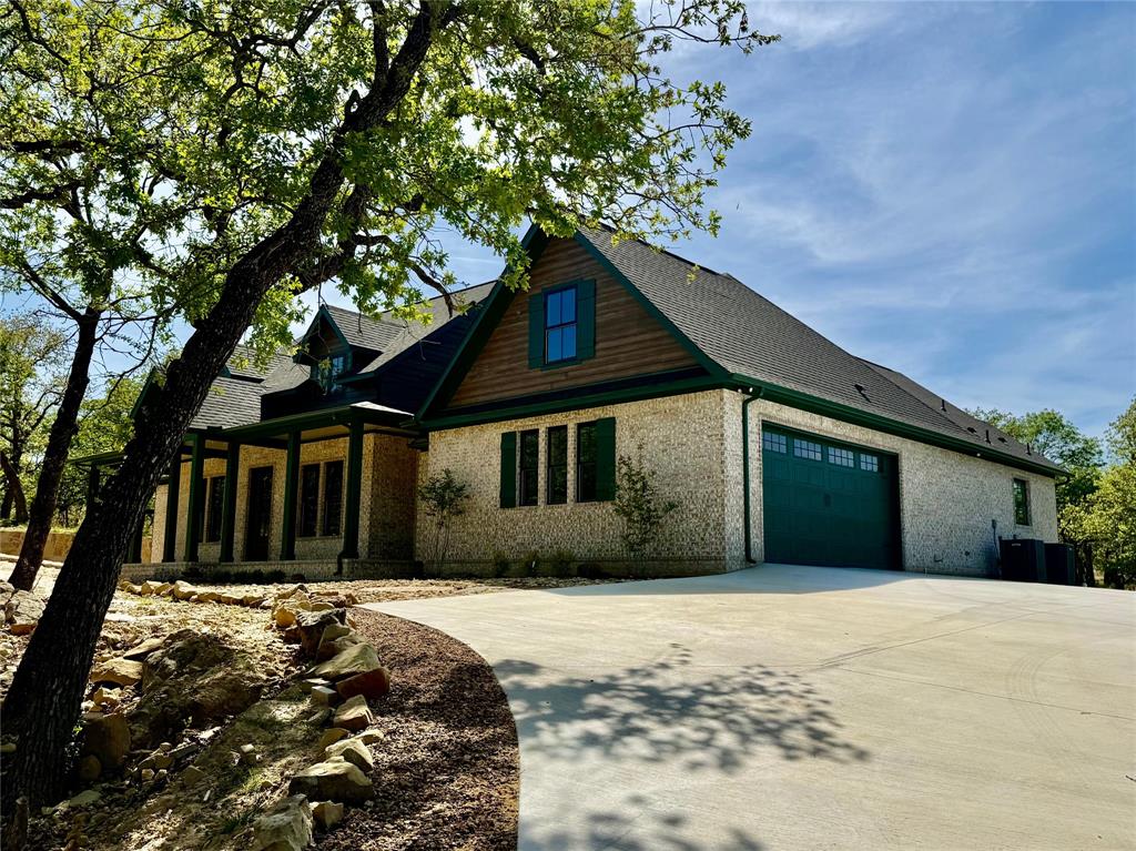 114 Ridgeline Drive Chico, TX 76431 - Photo 3 of 23 a front view of a house with a yard