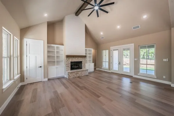 a kitchen with kitchen island granite countertop a stove oven and a sink