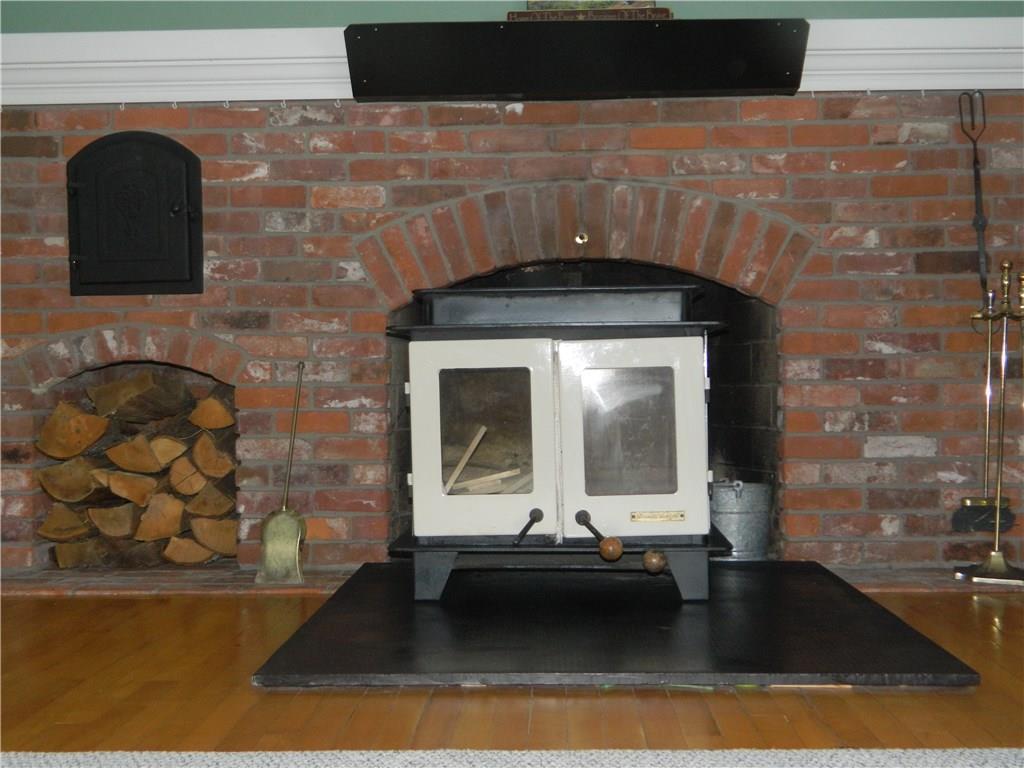 13 Marginal Way Springvale, ME 04083 - Photo 11 of 35 Living room fireplace with woodstove...