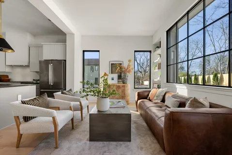 a view of living room filled with furniture and window