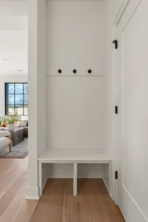 a workspace room with furniture and a potted plant