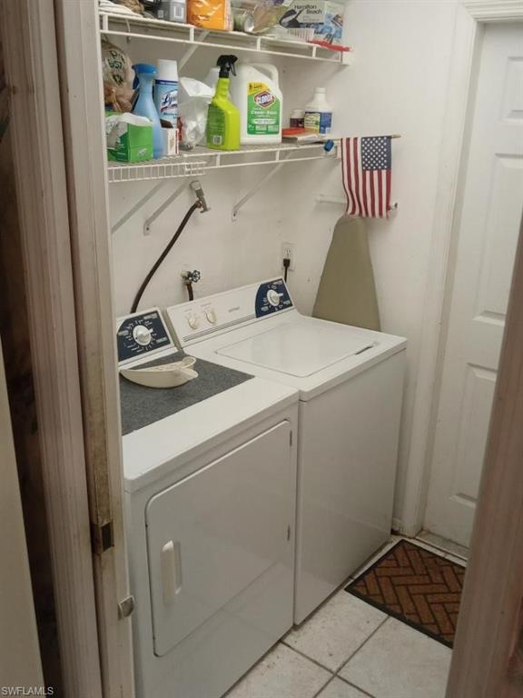 8213 Albatross Road Fort Myers, FL 33967 - Photo 15 of 17 a utility room with dryer and washer