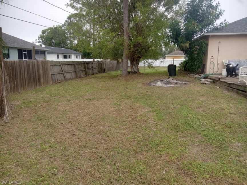 8213 Albatross Road Fort Myers, FL 33967 - Photo 17 of 17 a view of a backyard with large trees