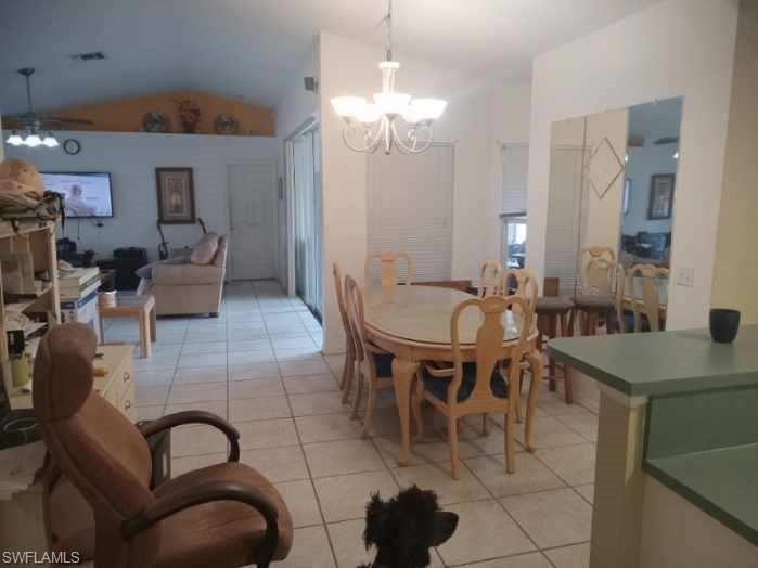 8213 Albatross Road Fort Myers, FL 33967 - Photo 4 of 17 a dining room with furniture and wooden floor