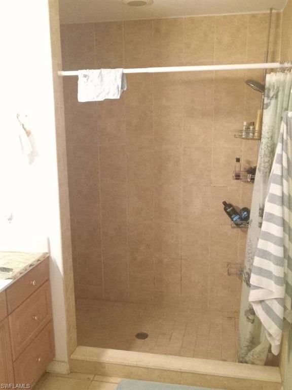 8213 Albatross Road Fort Myers, FL 33967 - Photo 10 of 17 a bathroom with a shower