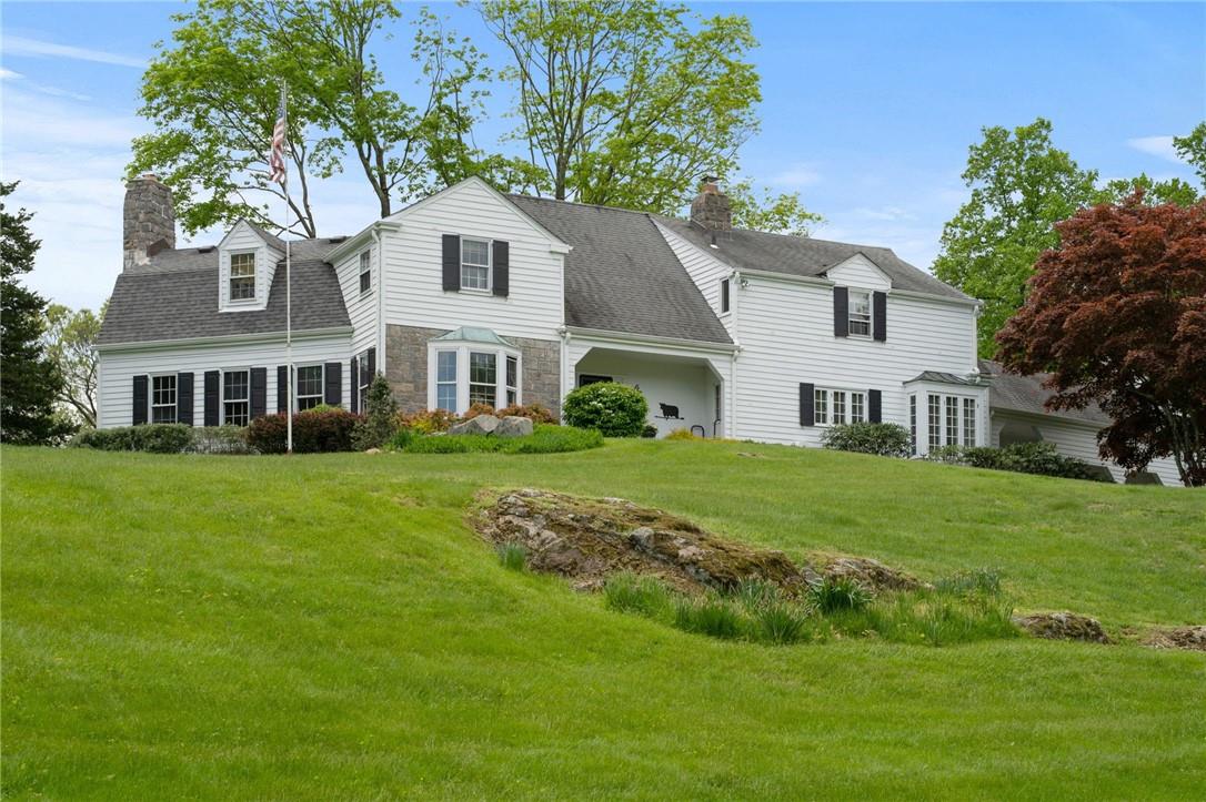 Orchard Hill-a quintessential Chappaqua estate with 5 BR/3.1 Bths, pond, dock, greenhouse, gym, patio, bocce court, vegetable garden, 6 acres, graciously set on a gentle hill-the charm of pre-war with modern amenities, owned by the same family for 50+ years