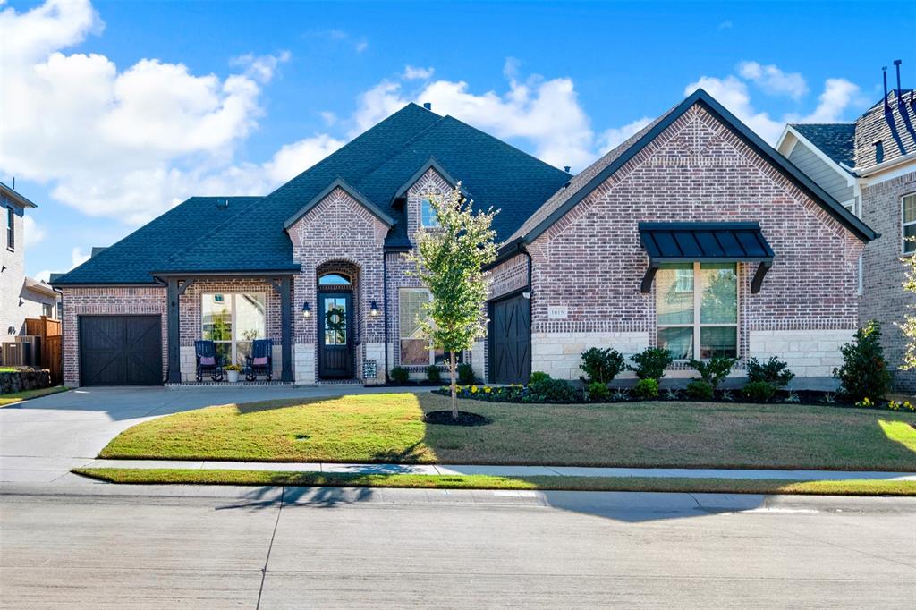 1015 Sable Drive Rockwall, TX 75087 - Photo 1 of 1 a view of a house with a big yard plants and large tree