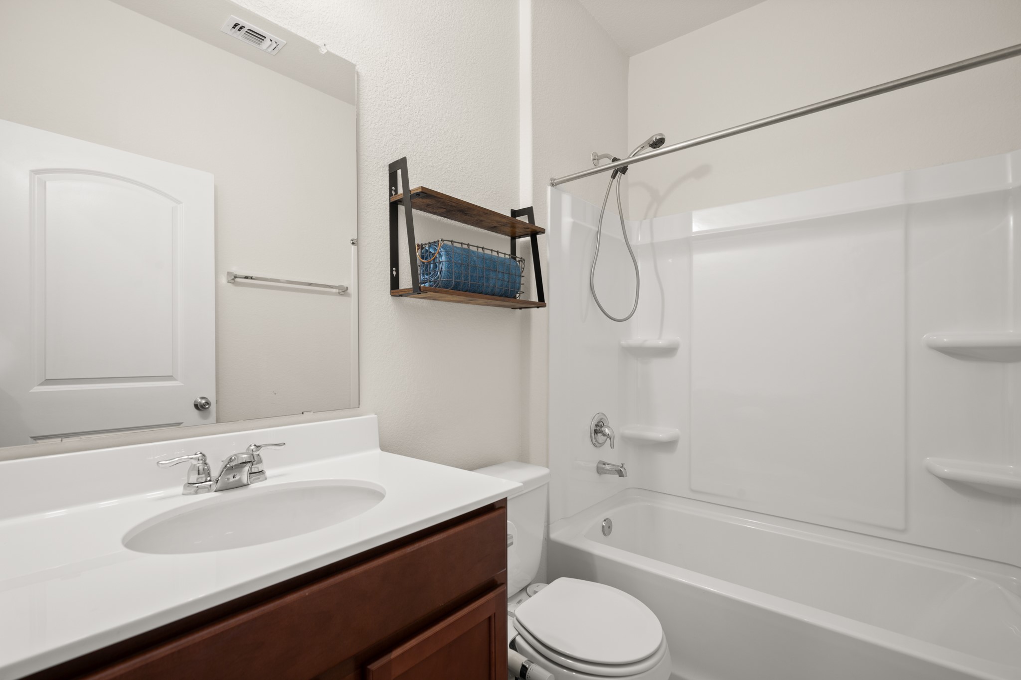 2300 Cliffbrake Way Georgetown, TX 78626 - Photo 12 of 28 a bathroom with a granite countertop sink a toilet and shower