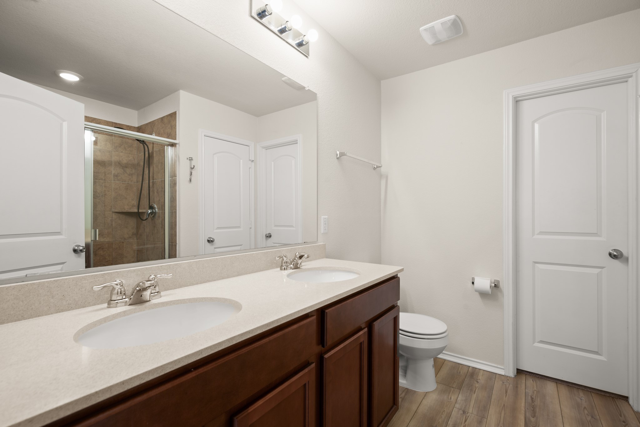 2300 Cliffbrake Way Georgetown, TX 78626 - Photo 18 of 28 a bathroom with a double vanity sink toilet and a mirror