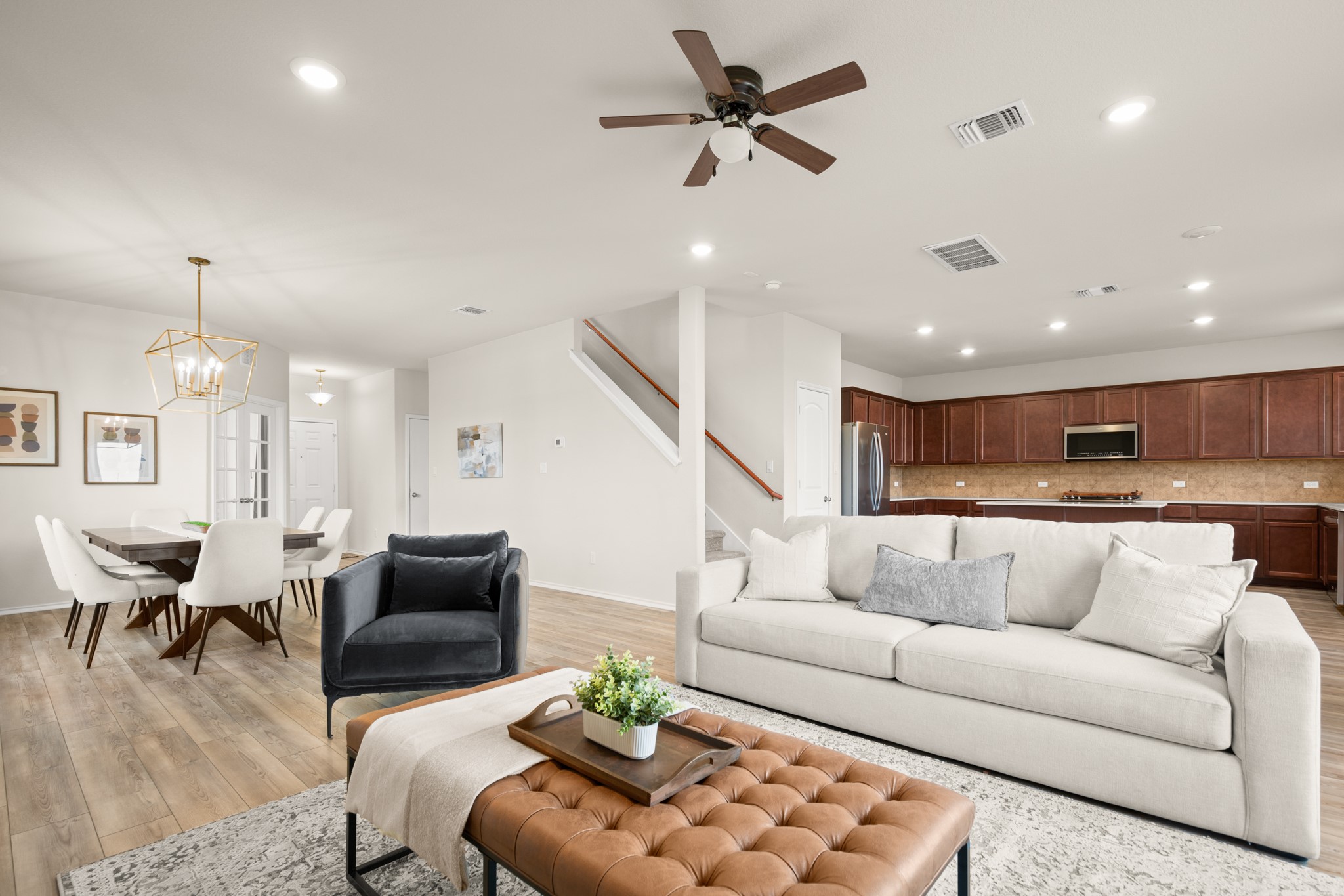 2300 Cliffbrake Way Georgetown, TX 78626 - Photo 6 of 28 a living room with furniture kitchen view and a chandelier