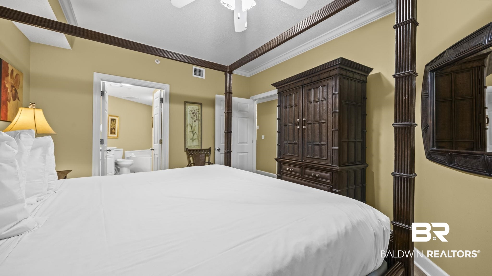 27580 Canal Road, Unit 214 BS 62 Orange Beach, AL 36561 - Photo 8 of 23 Bedroom featuring crown molding, a ceiling fan, and connected bathroom