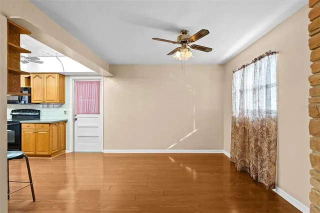 a view of kitchen with furniture and wooden floor