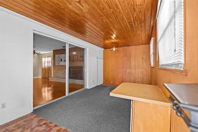 a view of empty room with floor to ceiling window