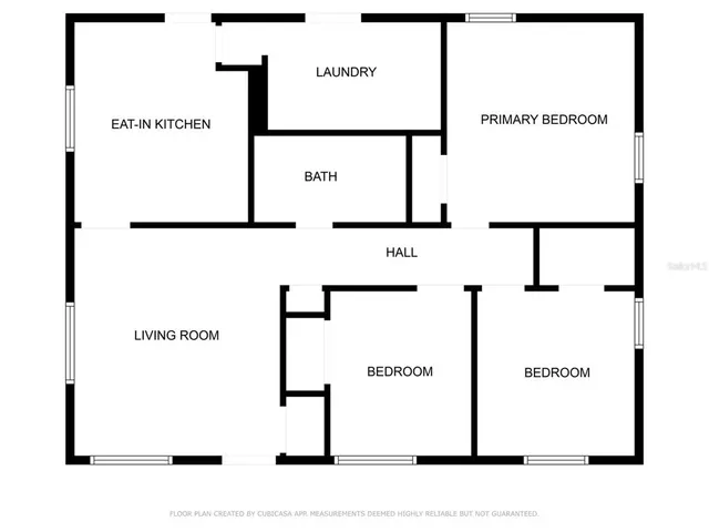 a front view of a house with outdoor seating