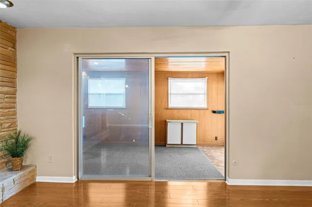 a view of a kitchen with wooden floor