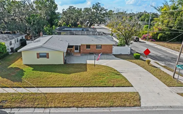 an aerial view of a house with a swimming pool