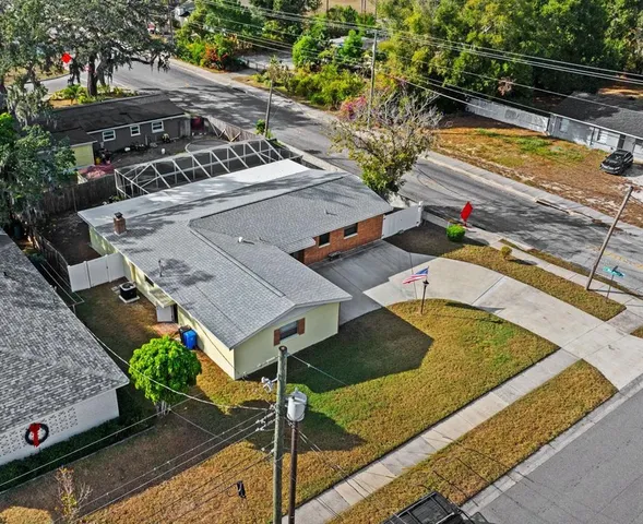 an aerial view of residential houses with outdoor space