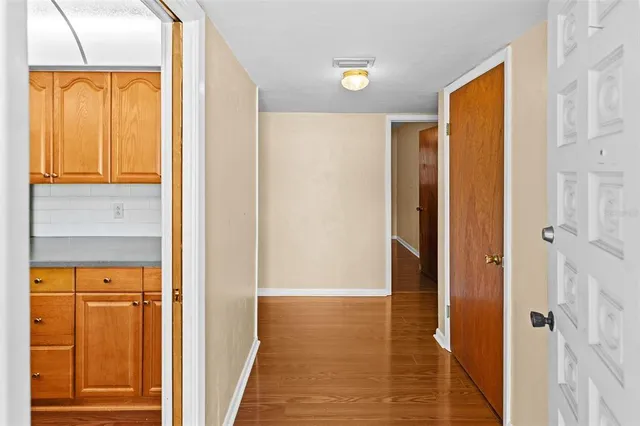 a view of room with window and hardwood floor
