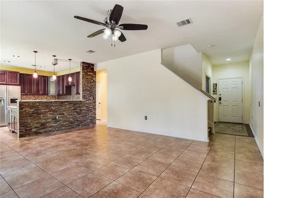 a view of a livingroom with a kitchen