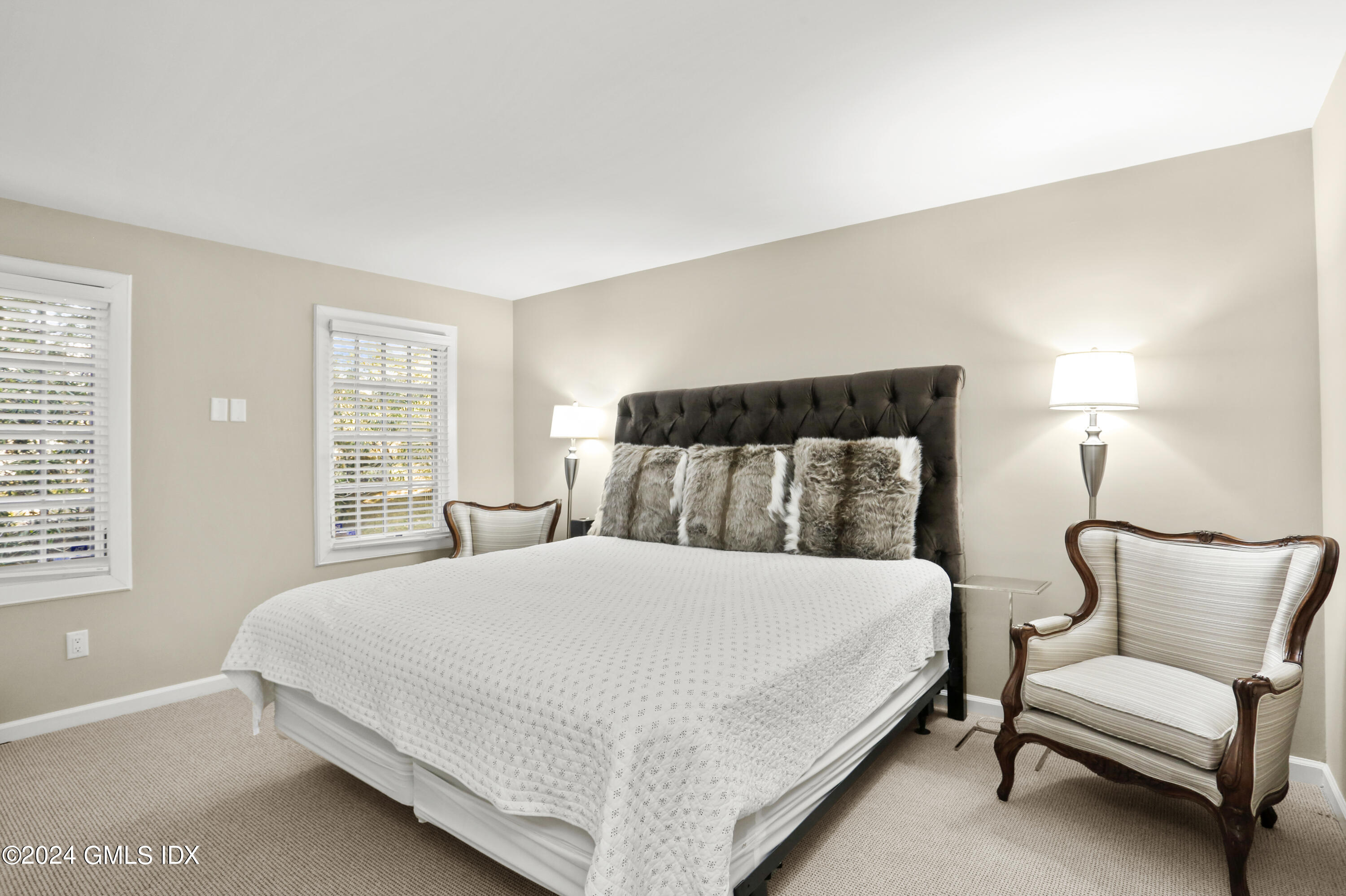186 Field Point Road, Unit 6A Greenwich, CT 06830 - Photo 14 of 32 a bedroom with a bed and a couch