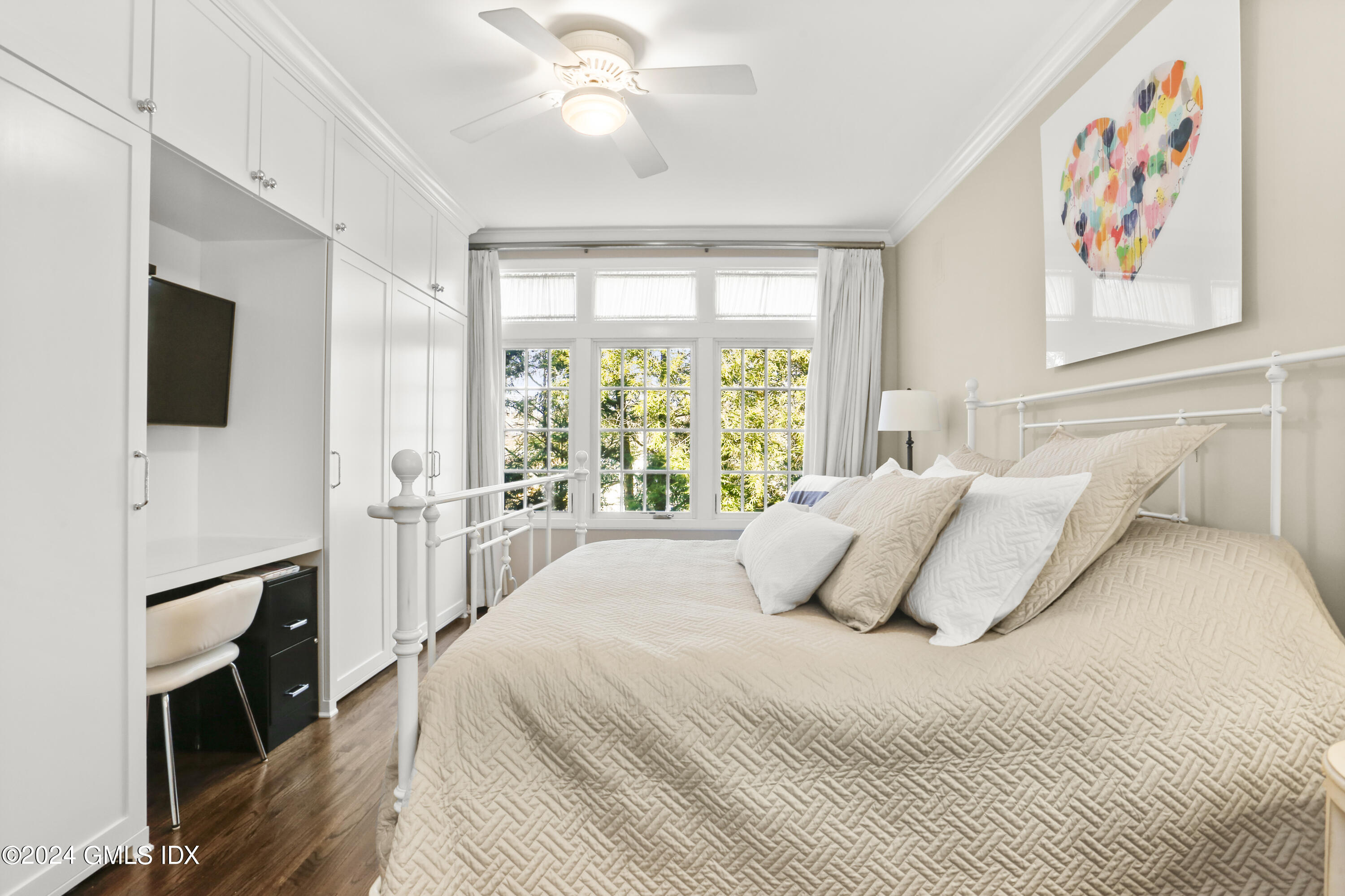 186 Field Point Road, Unit 6A Greenwich, CT 06830 - Photo 9 of 32 a bedroom with a balcony a bed and a flat screen tv