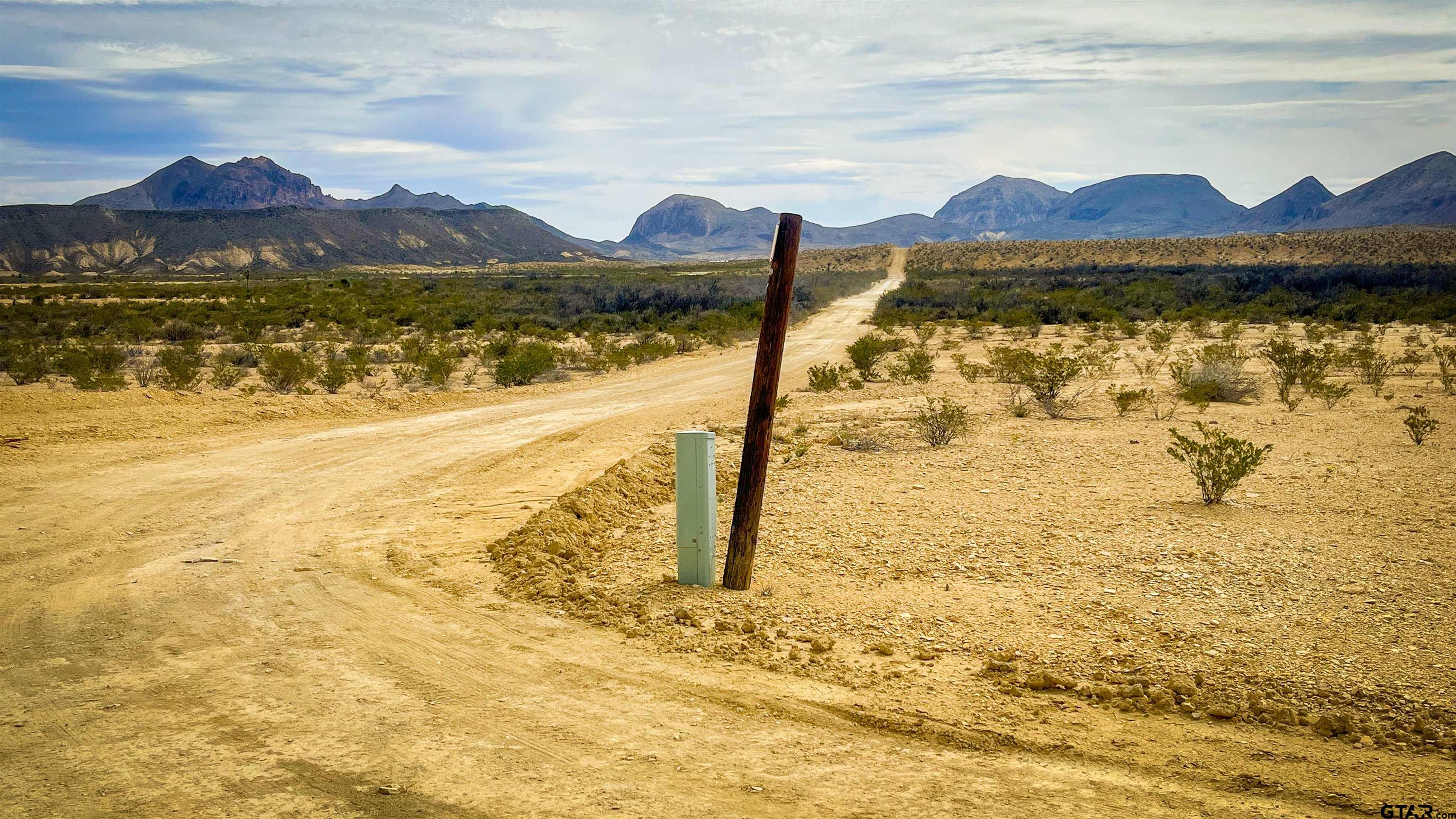 a view of an ocean and a mountain