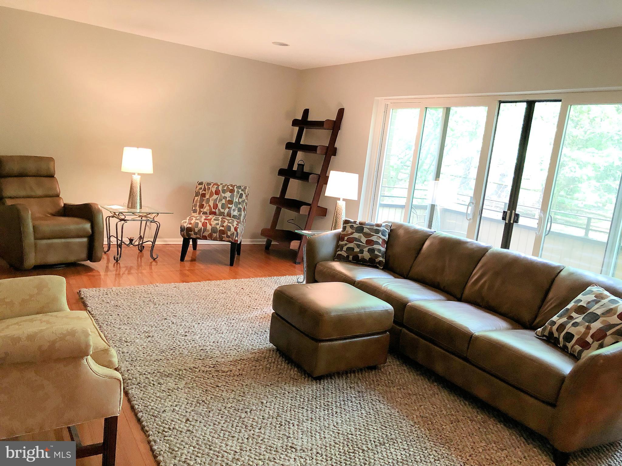 11042 Saffold Way Reston, VA 20190 - Photo 14 of 50 LIV RM with hdwd floor and walkout to balcony
