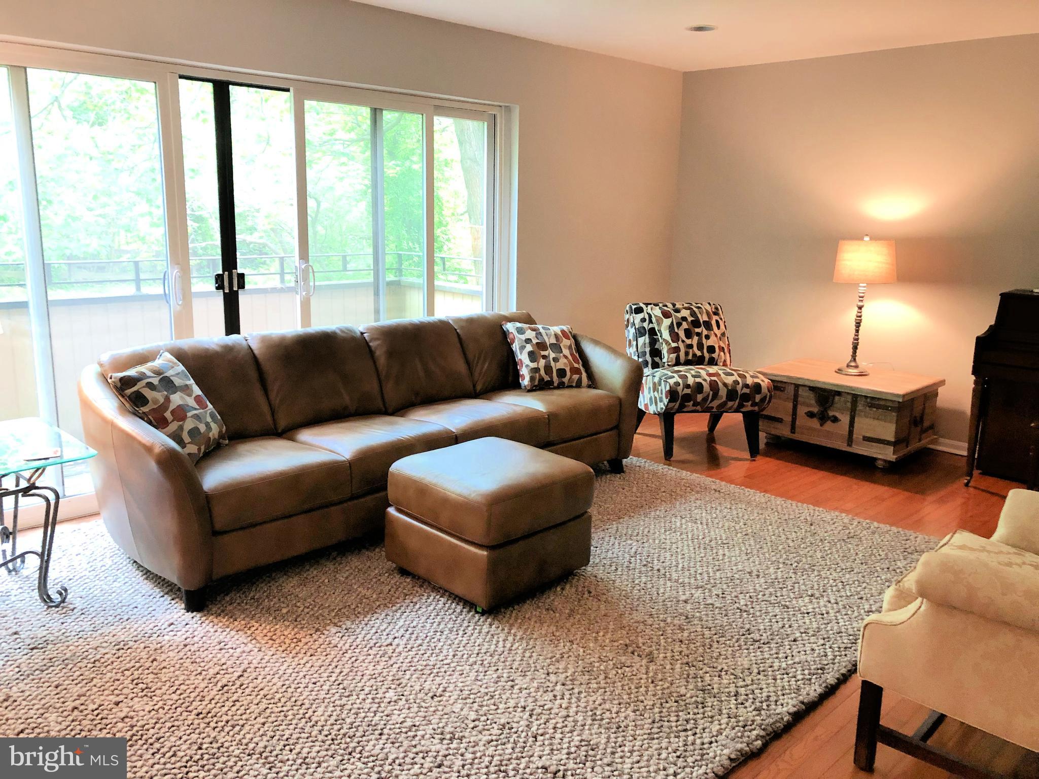 11042 Saffold Way Reston, VA 20190 - Photo 15 of 50 LIV RM with hdwd floor and walkout to balcony