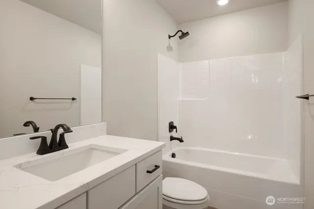 a bathroom with a sink a toilet and a bathtub