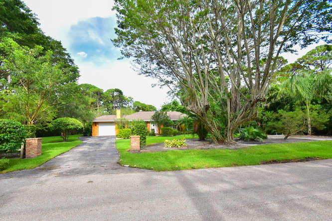 5531 Hibiscus Road Jupiter, FL 33458 - Photo 1 of 59 Front Exterior