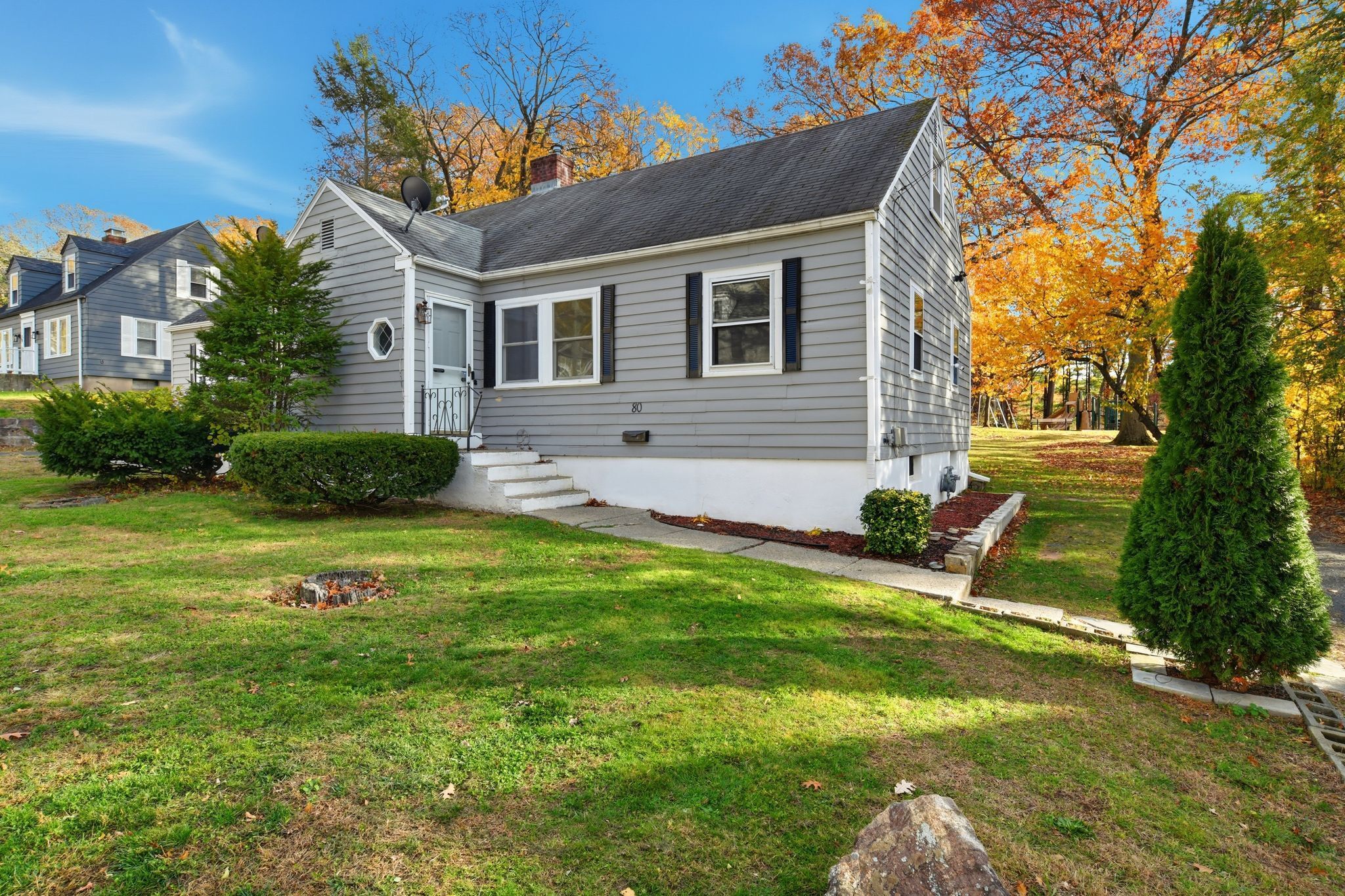 80 Hemlock Street Manchester, CT 06040 - Photo 5 of 32 a front view of a house with garden and patio