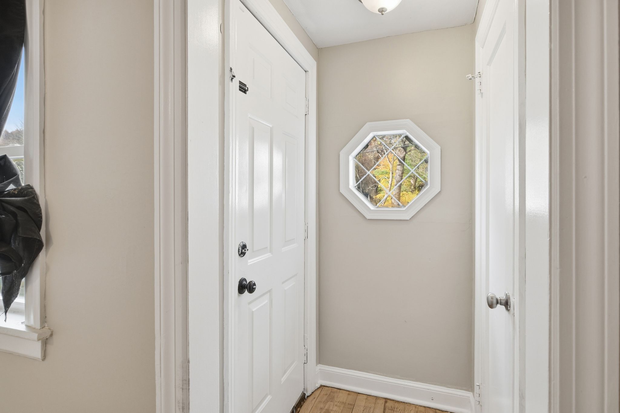 80 Hemlock Street Manchester, CT 06040 - Photo 6 of 32 a view of entryway with wooden floor and mirror