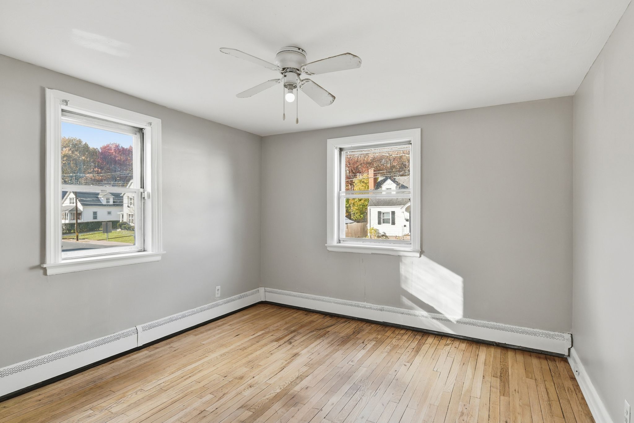 80 Hemlock Street Manchester, CT 06040 - Photo 7 of 32 a view of an empty room with wooden floor and a window