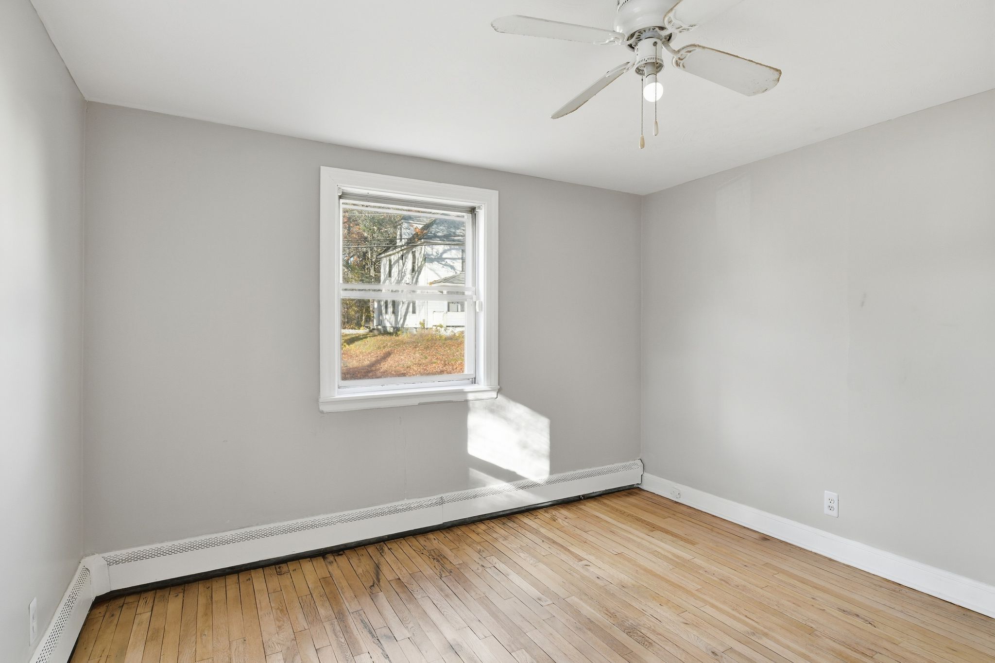 80 Hemlock Street Manchester, CT 06040 - Photo 8 of 32 wooden floor in an empty room with a window
