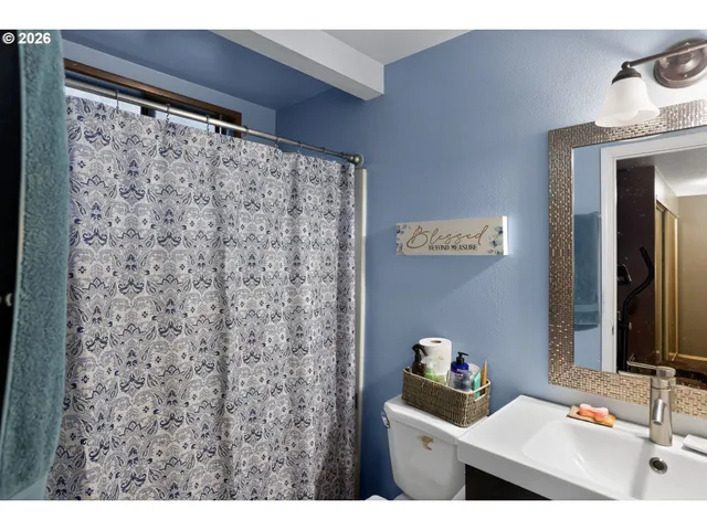 a bedroom with furniture and a chandelier