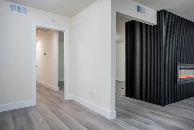 an empty room with wooden floor