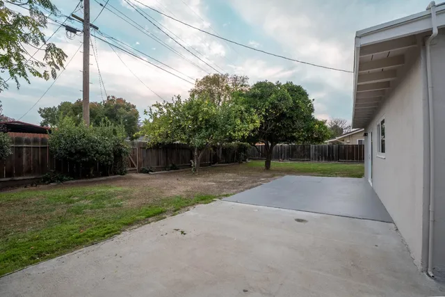 a view of backyard and entertaining space