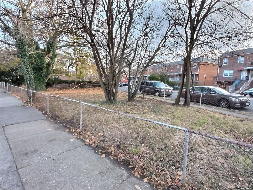 1644 Canarsie Road Brooklyn, NY 11236 - Photo 5 of 8 a view of a yard with a cars