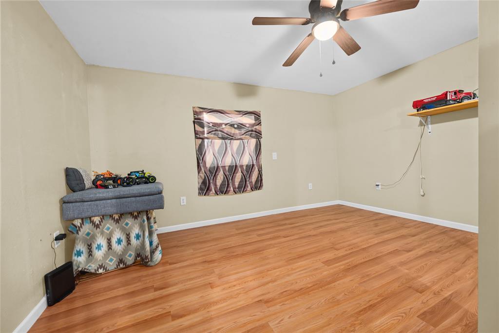 447 Masthead Road Gun Barrel City, TX 75156 - Photo 14 of 27 a view of a room with wooden floor and ceiling fan