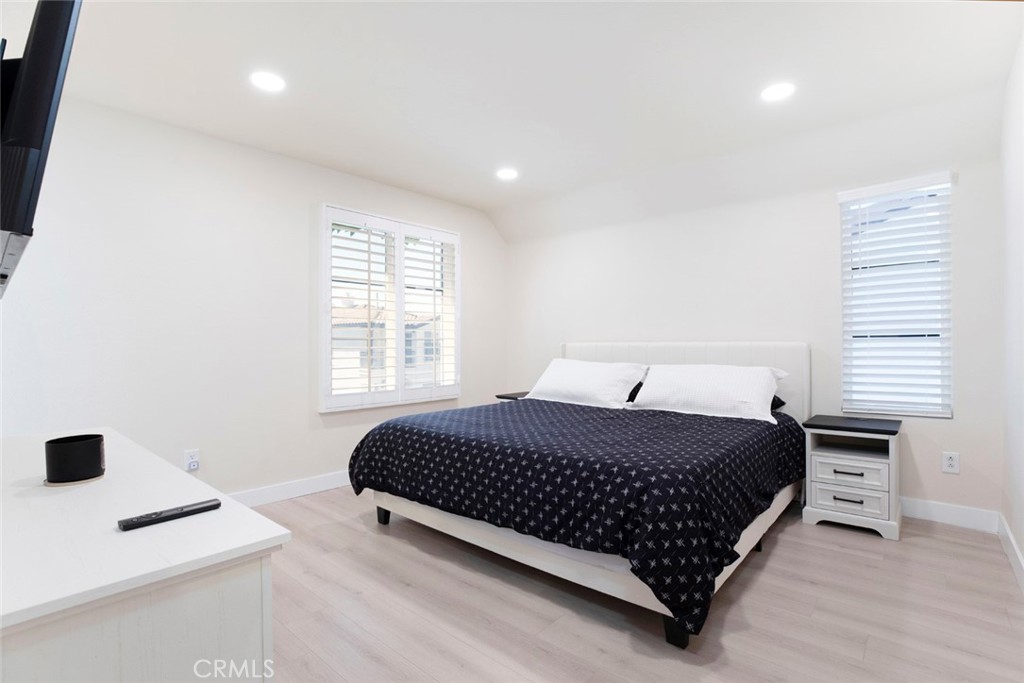 23301 Montecito Place Valencia, CA 91354 - Photo 19 of 45 a bedroom with a bed and a desk in it