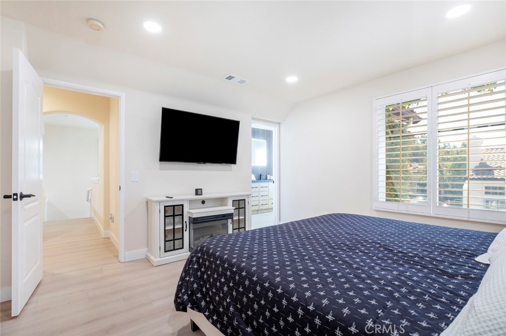 23301 Montecito Place Valencia, CA 91354 - Photo 20 of 45 a bedroom with a bed and a flat screen tv