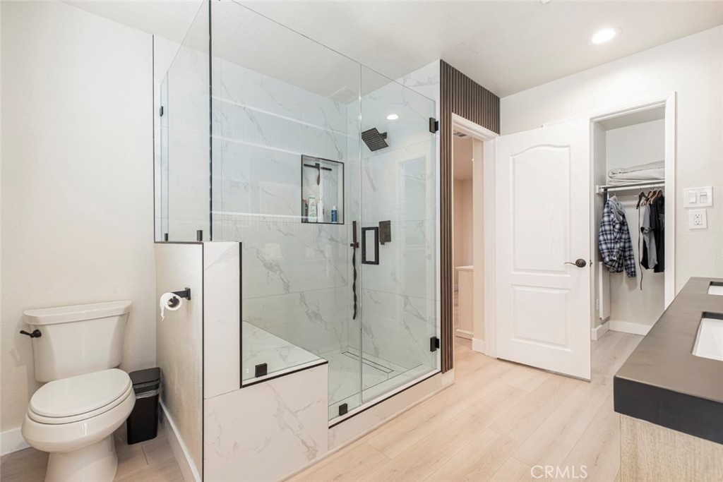 23301 Montecito Place Valencia, CA 91354 - Photo 22 of 45 a bathroom with a shower and a toilet