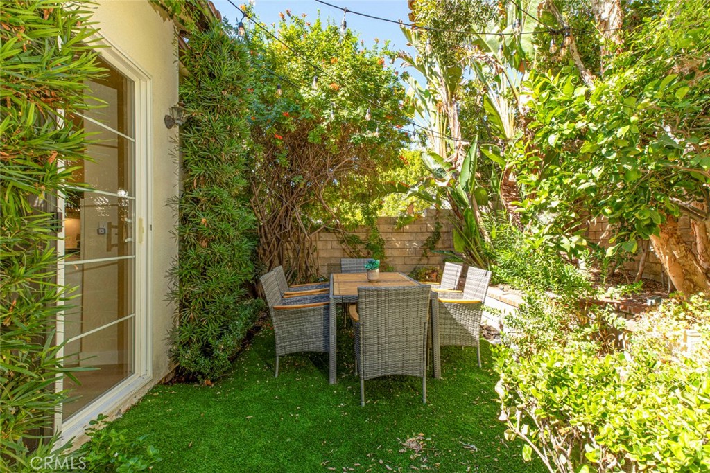 23301 Montecito Place Valencia, CA 91354 - Photo 29 of 45 a backyard of a house with table and chairs