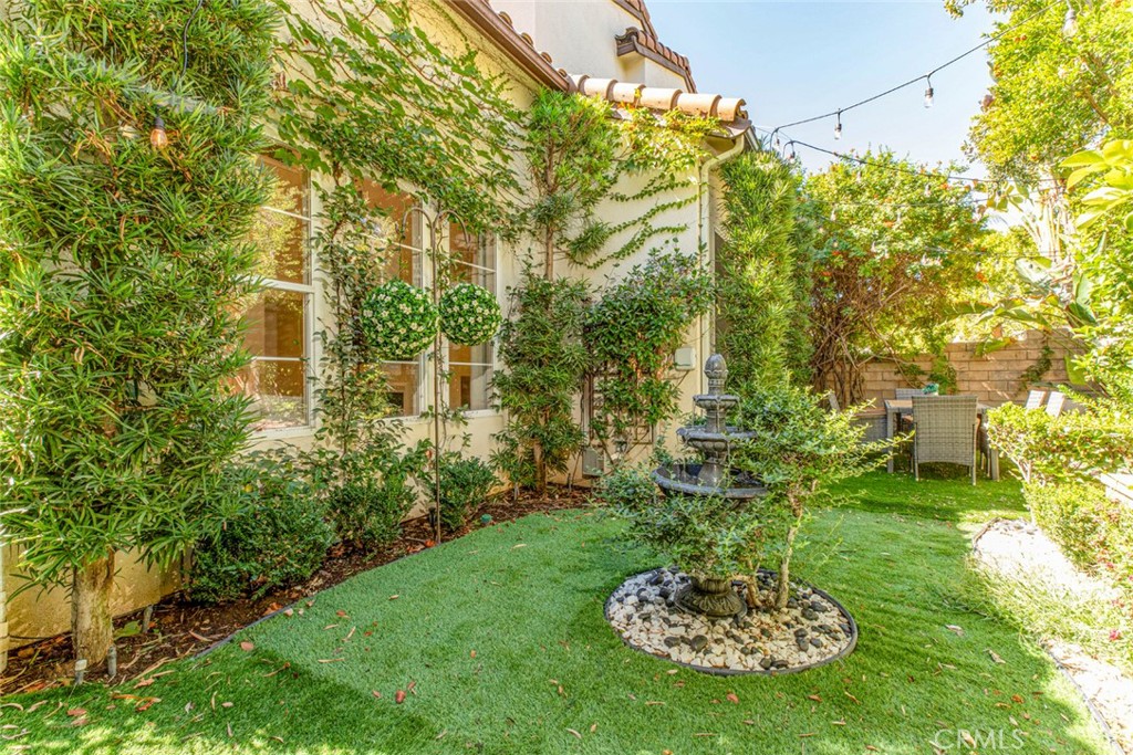 23301 Montecito Place Valencia, CA 91354 - Photo 34 of 45 a front view of a house with a yard