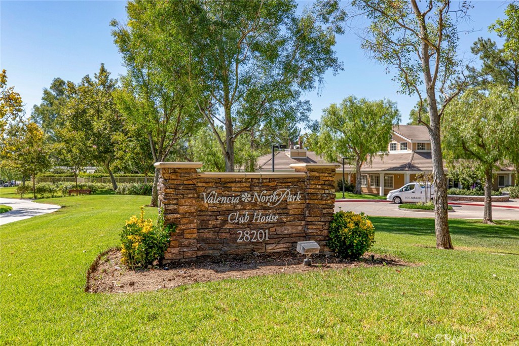 23301 Montecito Place Valencia, CA 91354 - Photo 35 of 45 a view of a wooden house with a big yard and large trees
