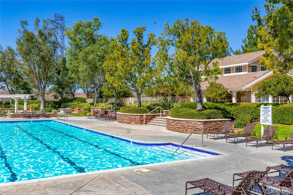 23301 Montecito Place Valencia, CA 91354 - Photo 38 of 45 a view of a swimming pool with a patio